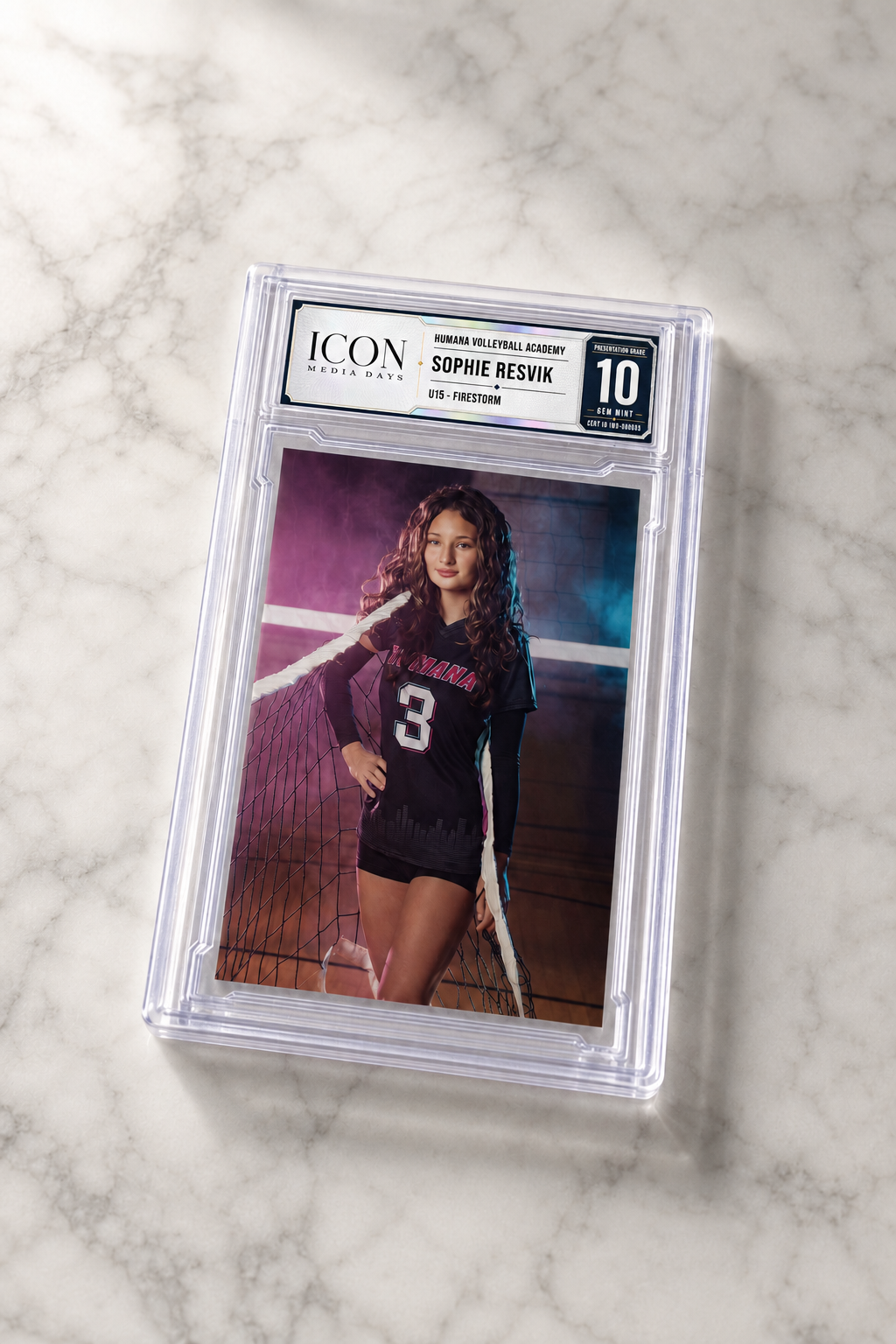 Card-encased slab with silver and navy ICON label