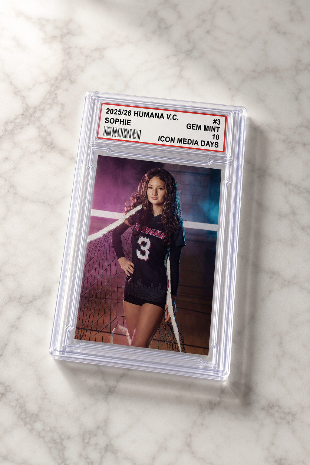 Athlete photograph in a card-encased display slab on a marble table